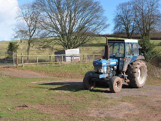 Tractor by a hillside in Welsh Newton
