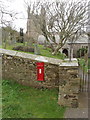 St Gennys church with Victorian post box