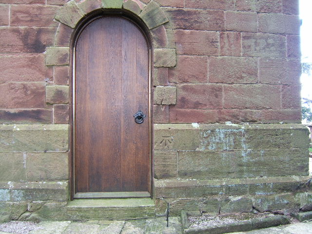 Doorway & Bench Mark on  St. Bartholomew's Church, Great Barrow