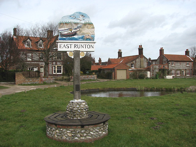 Village sign and pond at Low Common