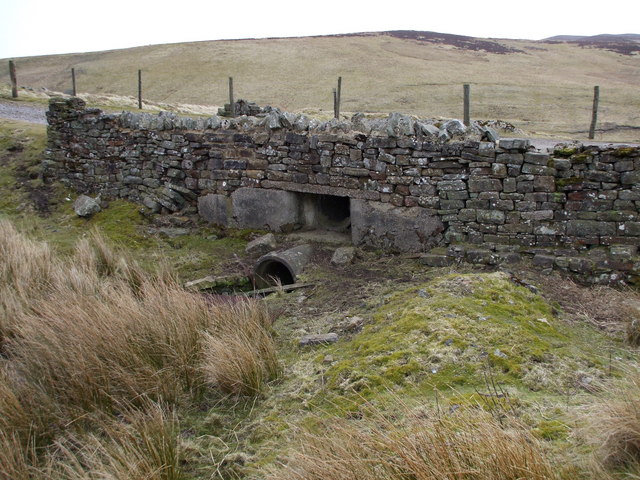 Concrete Culverts Hidden By a Stone Wall