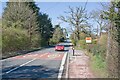 Salisbury Road (A36) passes the Post Office at West Wellow