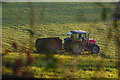 Farmer muck spreading