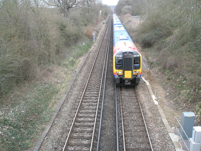 Train about to pass under Bartons Road Bridge