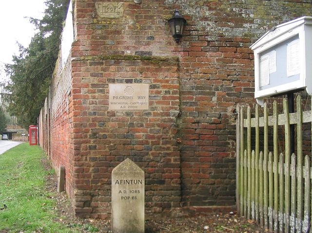 Signs on a wall outside Avington church