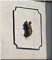 Close-up of embossed squirrel on house in Ashdon