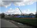 A crane looms over Borough Grove