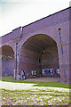 Graffiti in the arch of the Piccadilly Line Viaduct, Arnos Grove, London N14