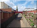 Slipway to the beach with Holy Trinity Church in the background