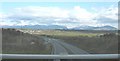 View south along the A55 Expressway with Snowdonia in the background