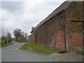 Farm buildings and the lane at Humphraston Hall