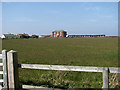 View across field beside Coast Road