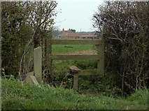 TL5001 : A stile and public footpath to Woodhatch by Robert Edwards