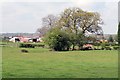 Farm buildings and fields.