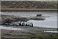 SD0894 : Fence and Small Boat in the Esk Estuary by Steve Partridge