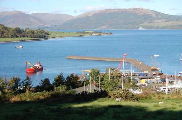 The bay at Port Bannatyne. A dredger works inside the new marina seawall.