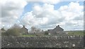 Houses between the road and rail bridges over the Cefni at Malltraeth