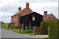 House with outbuildings at Aby