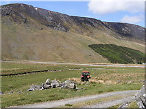 NH5208 : Tractor crossing under Carn Dubh by Sarah McGuire