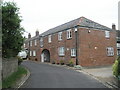 House with arch on bend in King Street