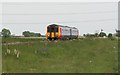 A train for Sleaford at Great Hale crossing .