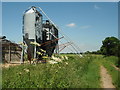 TL1184 : Feed Bins, Rectory Farm by Michael Trolove