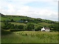 Two farms on the side of a hill