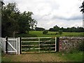 Gate infield from churchyard All Saints Church, Hilborough, Norfolk