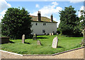 Cottages adjoining churchyard