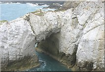 SH2576 : Y Bwa Gwyn and a sea cave by Eric Jones