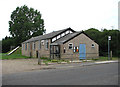 Bus stop and telephone box by village hall