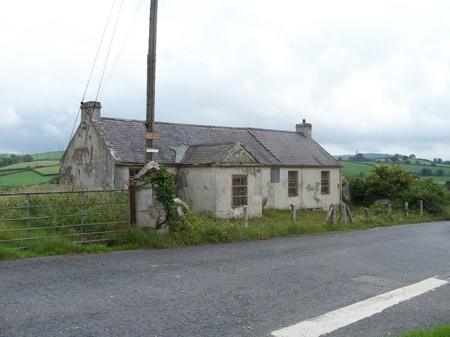 Ballystockart Mission Hall (derelict) with Scrabo Tower and hill in the distance