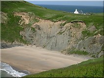 SN1951 : Mwnt cove / Traeth y Mwnt, and above it stands the medieval Holy Cross Church, Y Ferwig, Cardigan by Skinscribe