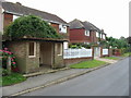 Nearly overgrown bus shelter on Maytham Road