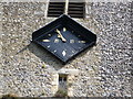 The clock on the Norman tower of the church of St. Peter and St. Paul, Borden