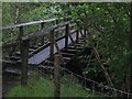 NN1475 : Footbridge using remains of old narrow-gauge railway bridge over Allt a'Mhuilinn by Phillip Williams
