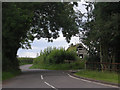 Lane passing a rotting barn