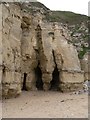 Caves in the cliff face at Marsden Bay