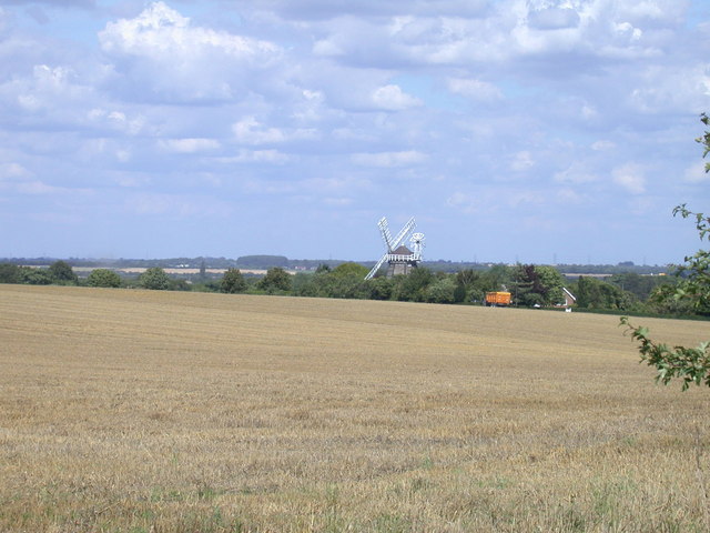 Harvested field and windmill