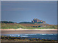 NU2033 : Monks House with Bamburgh Castle by Chris Gunns