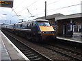 Locomotive 91125 speeds past Finsbury Park station