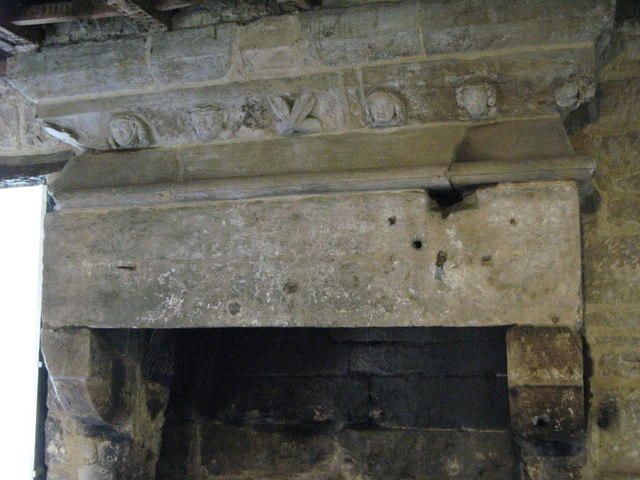 Carvings above mediaeval fireplace, Aydon Castle