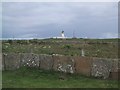 ND3854 : Lighthouse at Noss Head over a Caithness Stone Flag Wall by Sarah Charlesworth