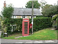 SY5388 : Puncknowle: postbox № DT2 82 and phone box by Chris Downer