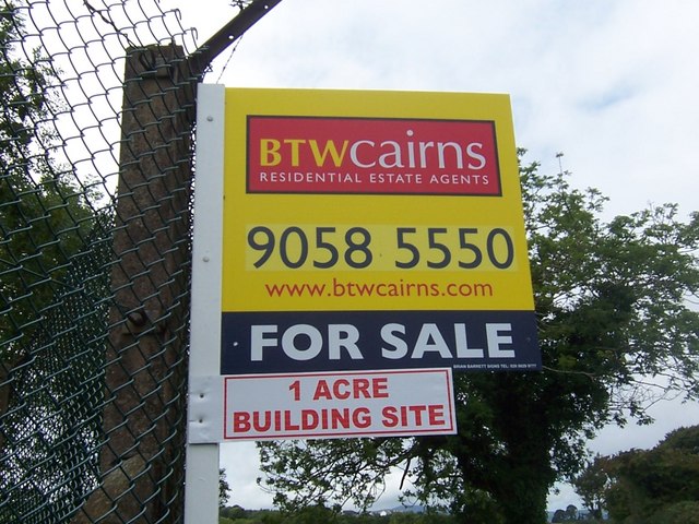 "For Sale" sign.