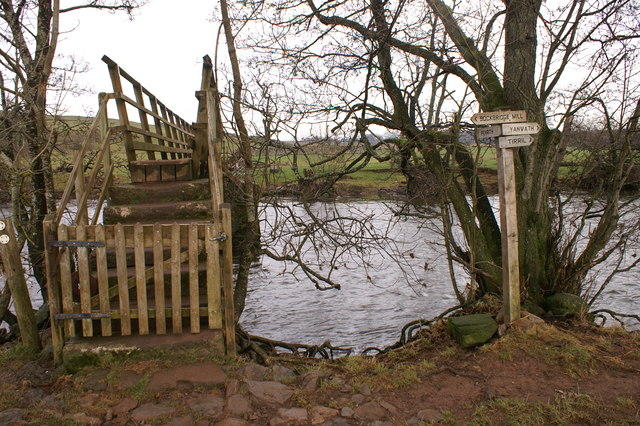 Footbridge over River Eamont with sign