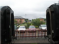 View between trains towards the industrial estate at Bishops Lydeard Station