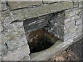 Stone trough in the wall opposite the Rose & Crown