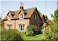 SU5730 : Estate Cottages, Tichborne Park by Pierre Terre