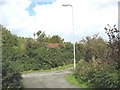 Red roofed shed at minor road junction in Llanddona village